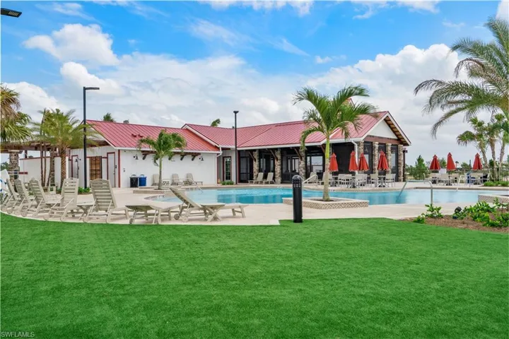 View of swimming pool featuring a yard and a patio area