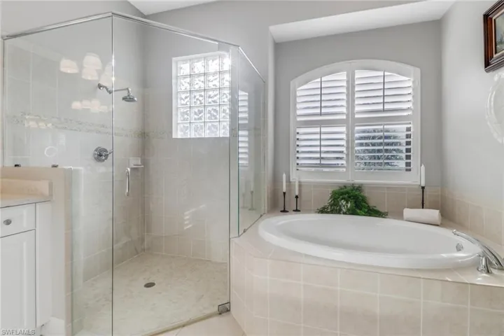 Full bathroom with a garden tub, a stall shower, and vanity