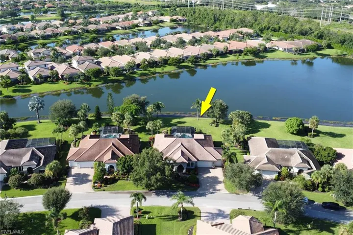 Aerial view of residential area with a large body of water