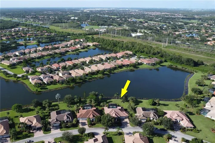 View of property location with nearby suburban area and a nearby body of water