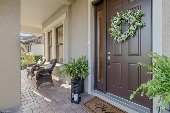 Property entrance with stucco siding