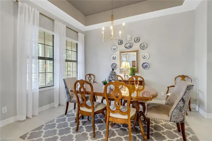Dining room featuring a chandelier and light tile patterned floors