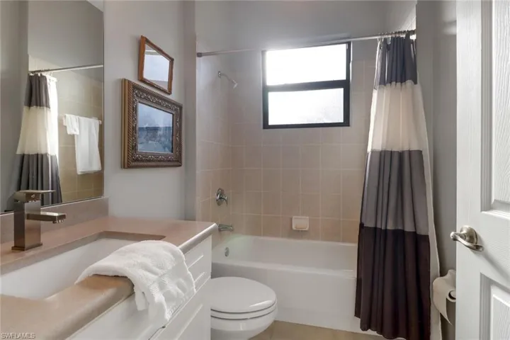 Bathroom with vanity and shower / bath combo