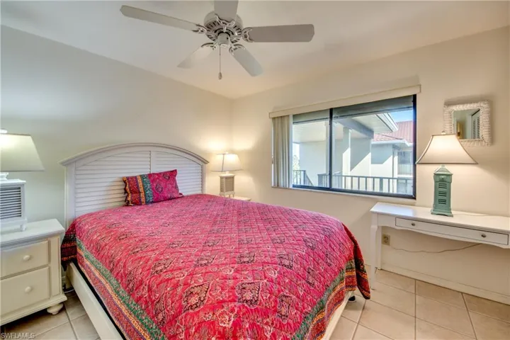 Tiled bedroom with ceiling fan