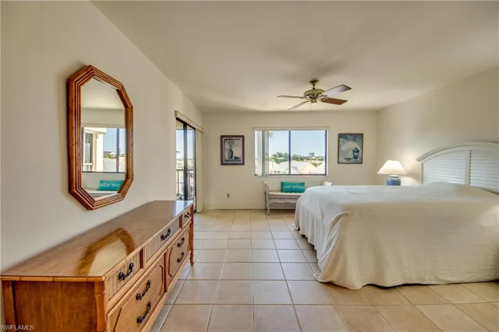 Tiled bedroom with ceiling fan
