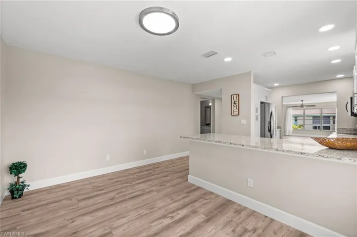 Looking from the front door to the breakfast nook and kitchen