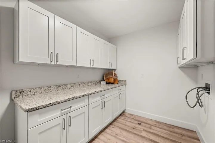 Big Laundry Room with lots of cabinets and storage