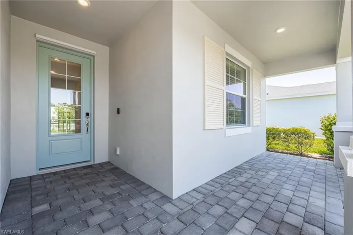Property entrance with stucco siding