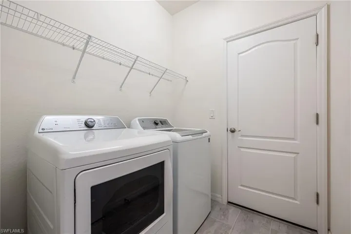 Clothes washing area with washer and clothes dryer
