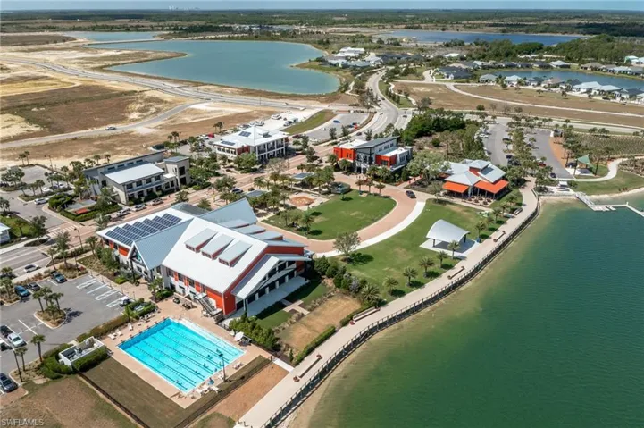 Drone / aerial view of a large body of water and a pool