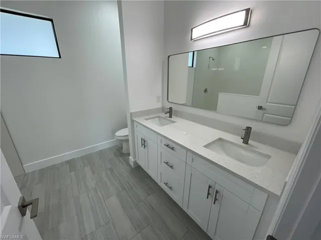 Bathroom with vanity and toilet
