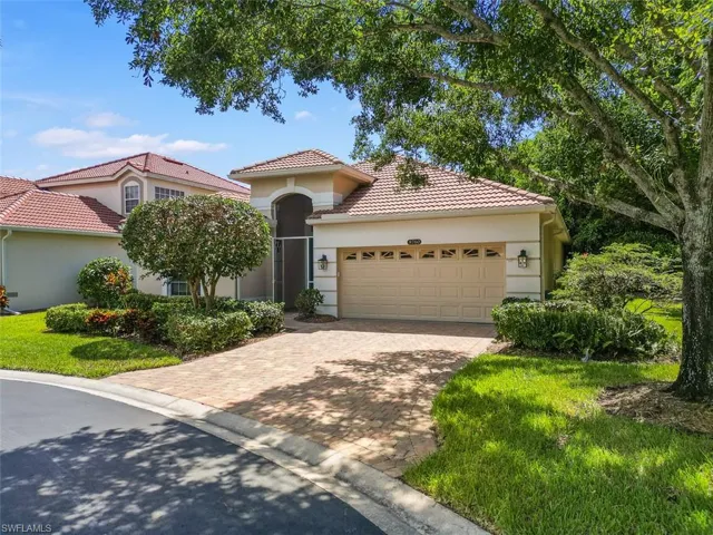 Timeless style home featuring a garage