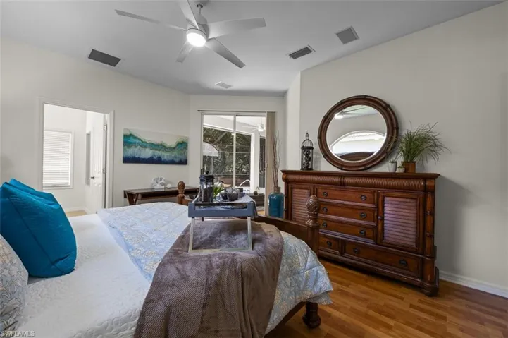 Bedroom featuring ceiling fan and hardwood / wood-style floors