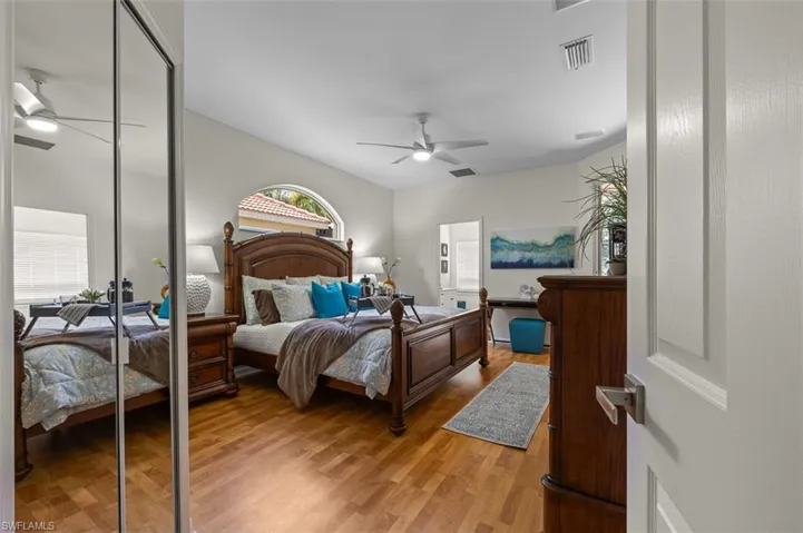 Bedroom with light hardwood / wood-style flooring and ceiling fan
