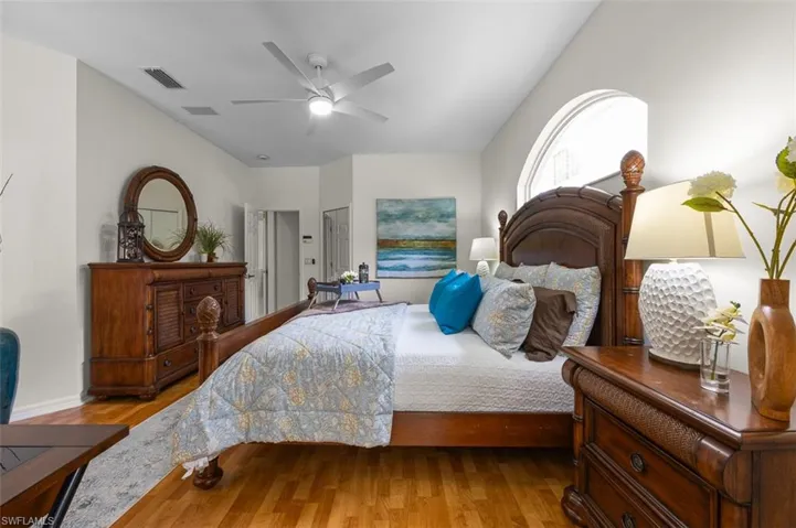 Bedroom featuring light hardwood / wood-style flooring and ceiling fan