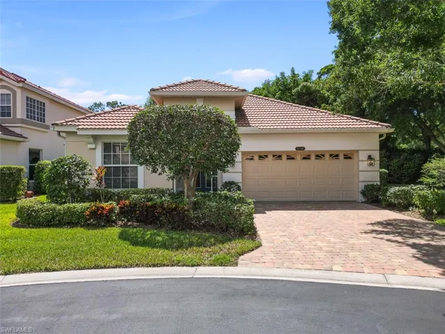 Timeless style home featuring a garage