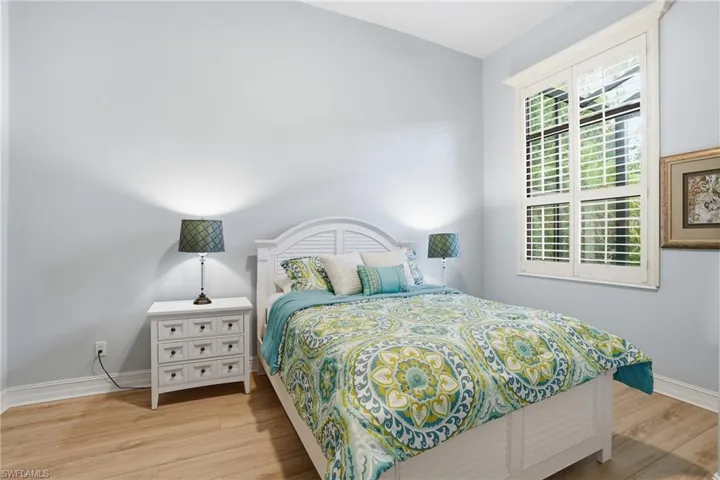 Bedroom featuring light wood-style flooring and baseboards