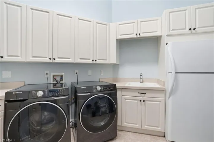 Washroom with independent washer and dryer and cabinet space