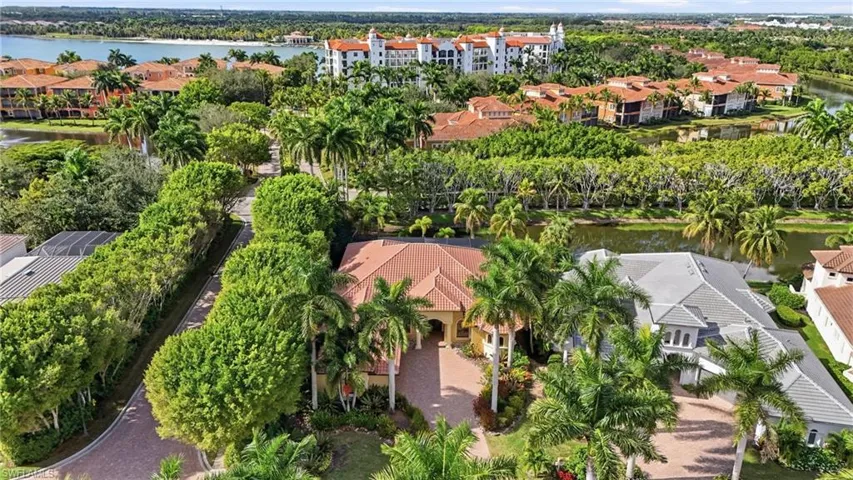 Aerial perspective of suburban area with a nearby body of water