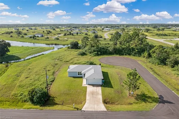 Aerial view of home with canal view