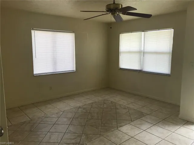Tiled floor, large windows and ceiling fan