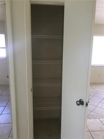 Hall closet for pantry or linen storage