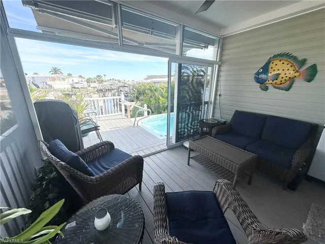 Rear porch leading to the swimming spa