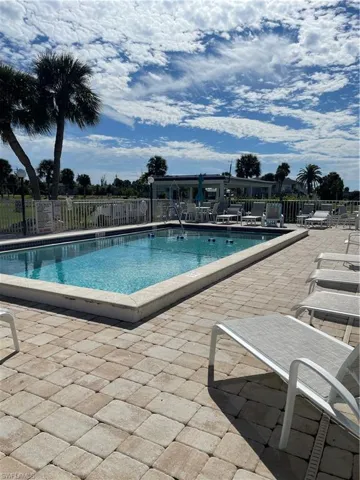 Community pool with a patio area
