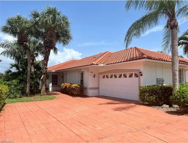Mediterranean / spanish house with a garage
