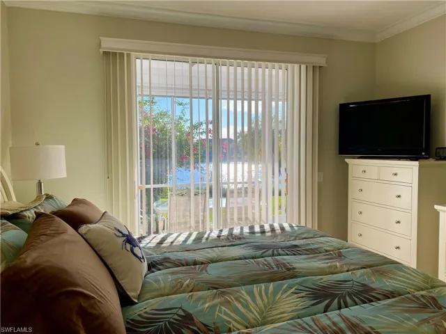 Bedroom featuring crown molding