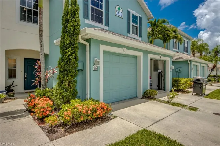 View of property with a garage