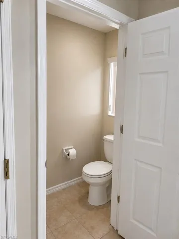 Private water closet in primary bathroom.