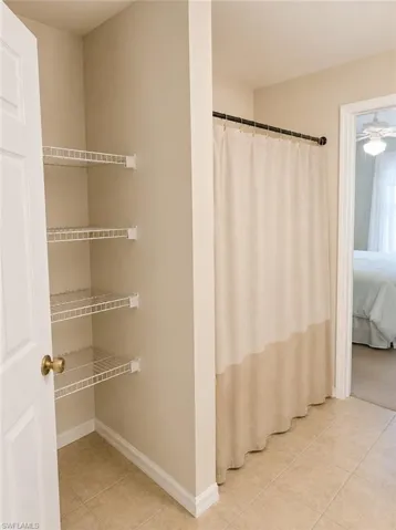 Guest bath attached to the guest suite with linen storage.