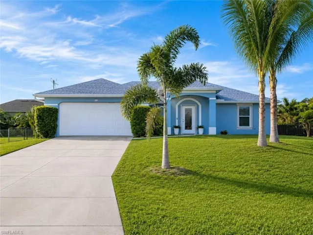 Fresh exterior paint, mature palms, and great curb appeal.