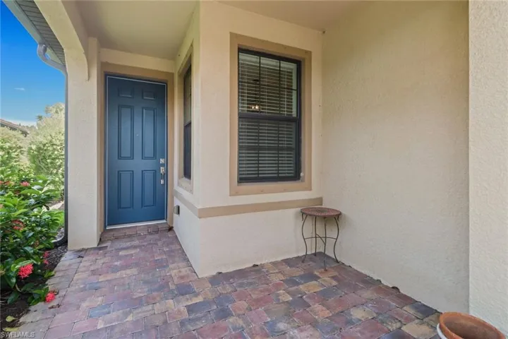 Property entrance with stucco siding