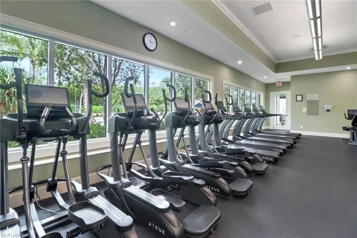 Workout area with ornamental molding and recessed lighting