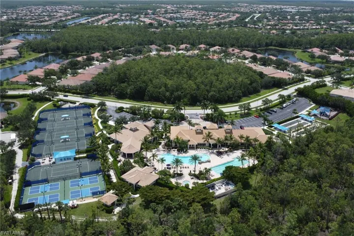 Aerial overview of property's location featuring a large body of water and nearby suburban area