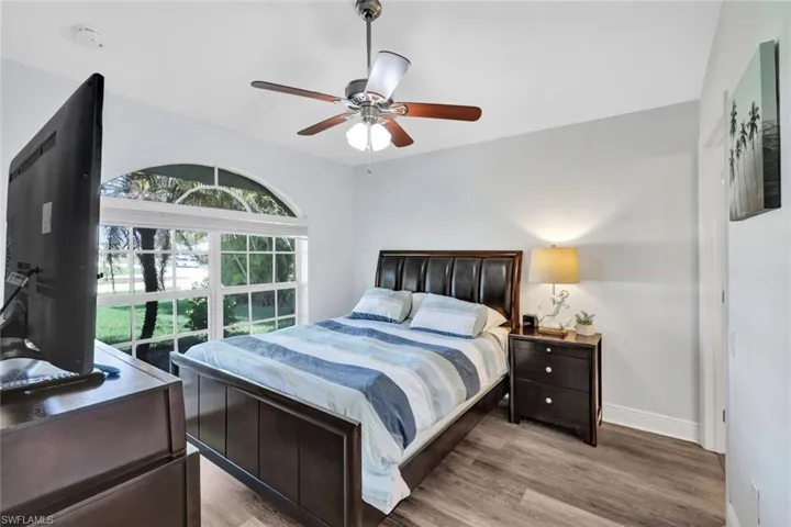 Bedroom featuring ceiling fan and wood-type flooring