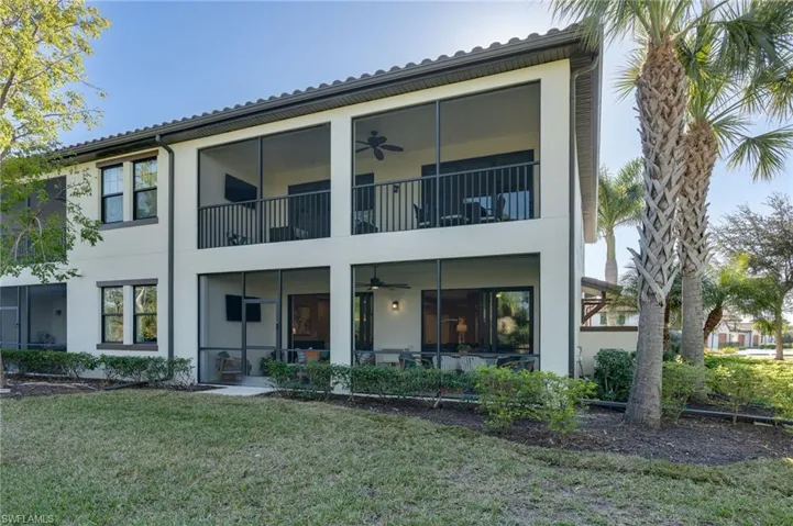 The back of the property illustrates the end-unit position that offers privacy and additional windows and shows the side and backyard.