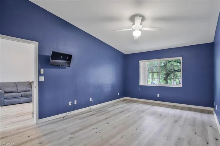 Spare room with ceiling fan and light hardwood / wood-style flooring