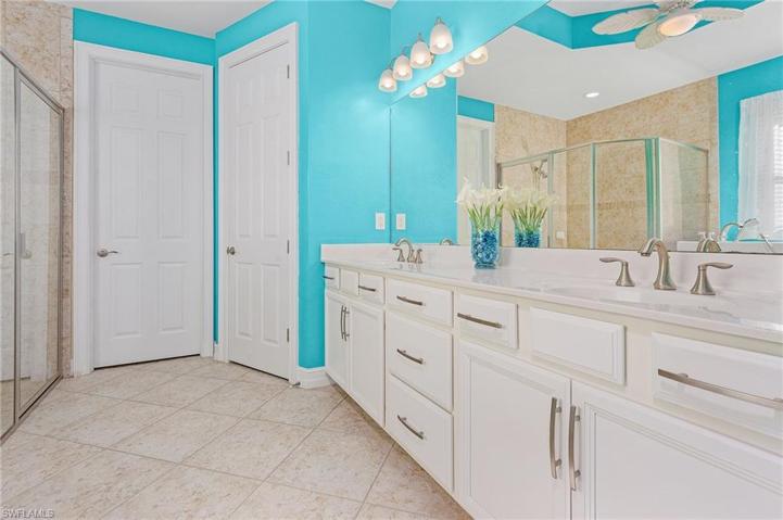 Ensuite with double bowl vanity, separate shower and easy entry tub.