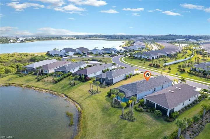 Pool overlooks community lake.