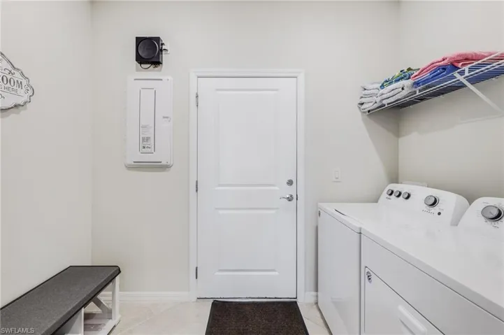 Laundry rm opens to 2-car garage.