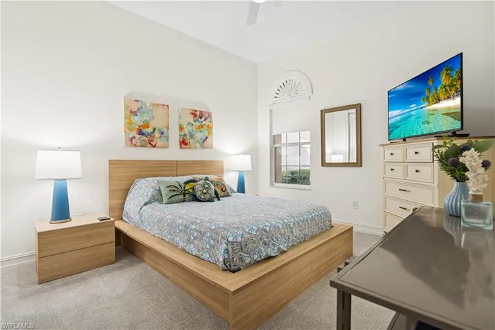 Bedroom with light carpet and ceiling fan