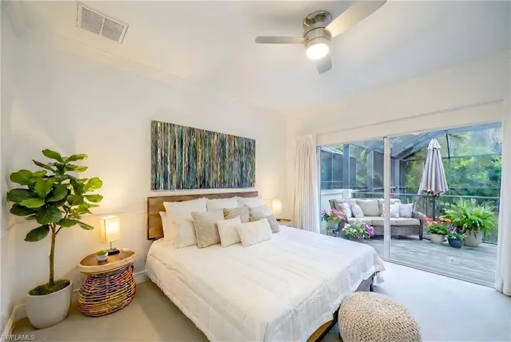 Bedroom with ornamental molding, access to exterior, and a ceiling fan