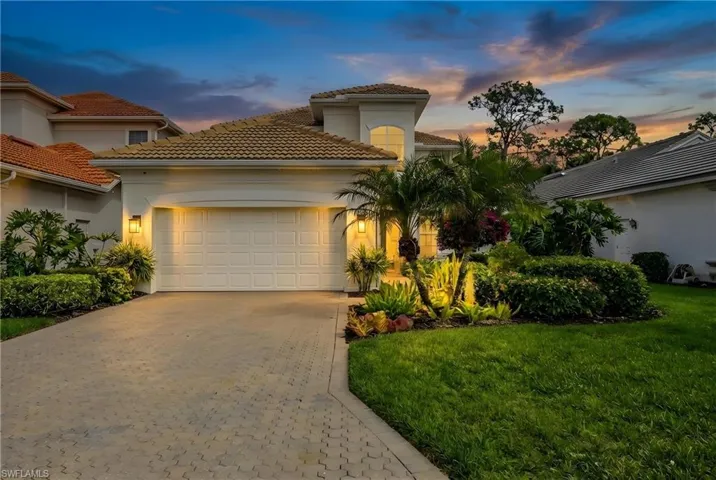 Mediterranean / spanish-style home featuring decorative driveway, stucco siding, a garage, and a tiled roof
