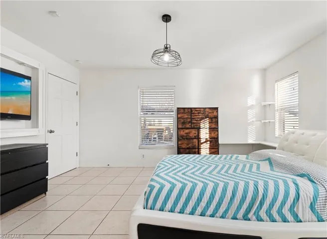 Bedroom featuring light tile patterned floors
