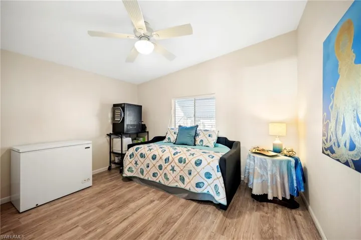 Bedroom with light wood-type flooring and ceiling fan