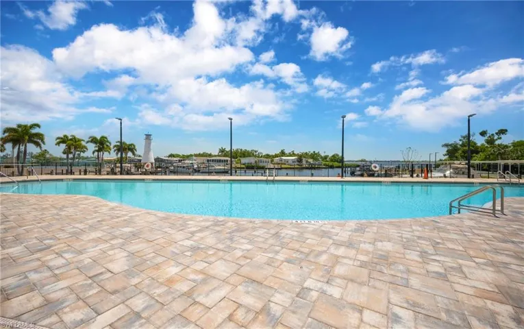 Community pool featuring a patio