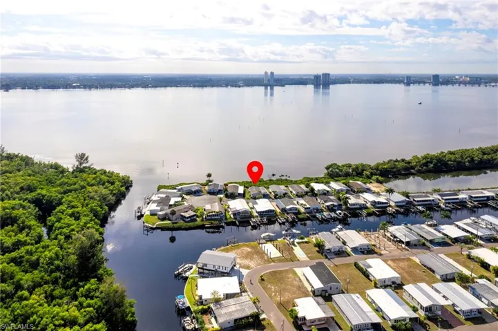 Aerial overview of property's location with a large body of water